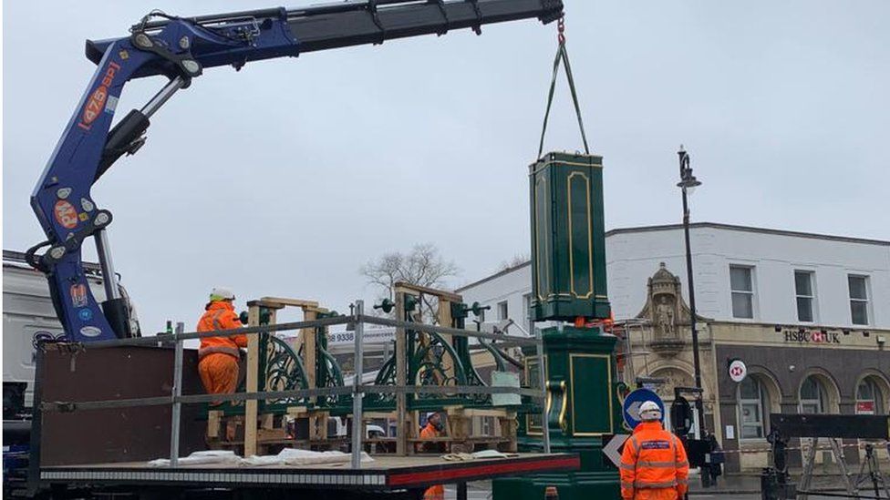 Clock being lifted into place
