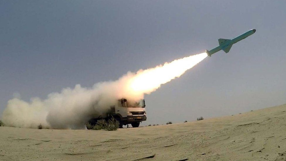 A handout photo shows a missile being fired from a mobile launch vehicle during an Iranian military exercise in the Gulf of Oman (18 June 2020)