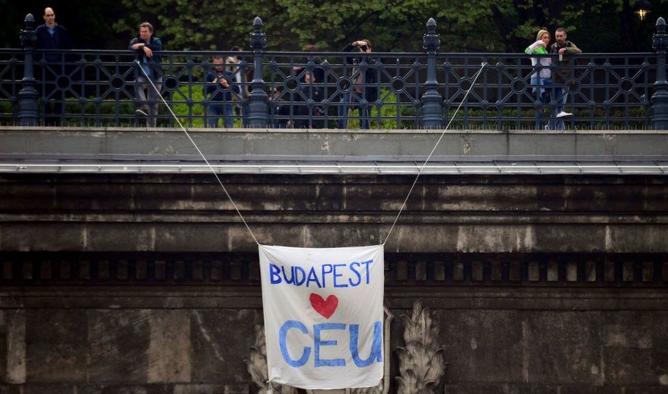 A banner reading "Budapest loves CEU" hangs over the Budapest tunnel, as Students and teachers of the Central European University protest in Budapest with their sympathizers