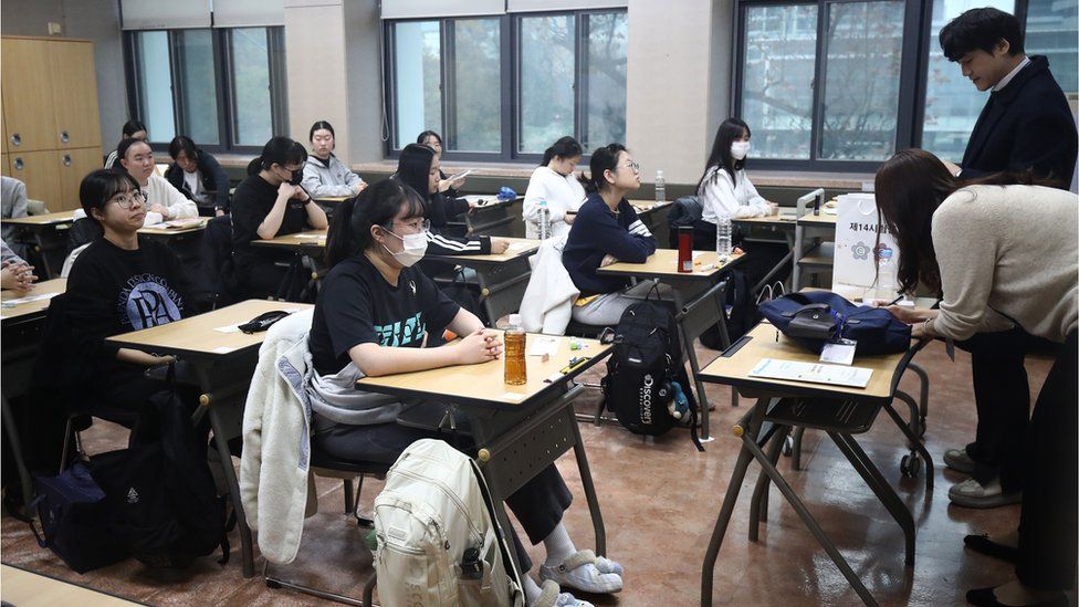 South Korean students wait to take the annual College Scholastic Ability Test at a school in Seoul, South Korea, 16 November 2023