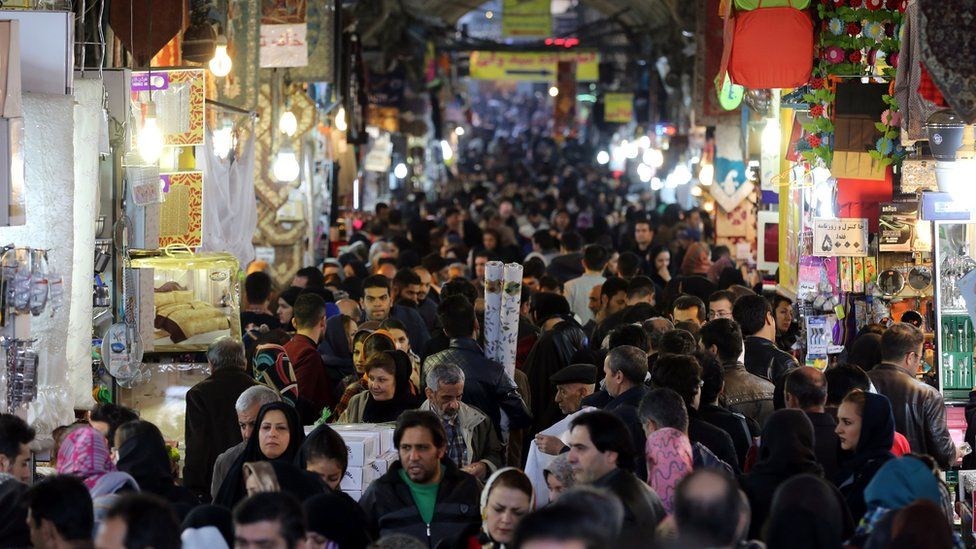 Iranians shop in Tehran's ancient Grand Bazaar