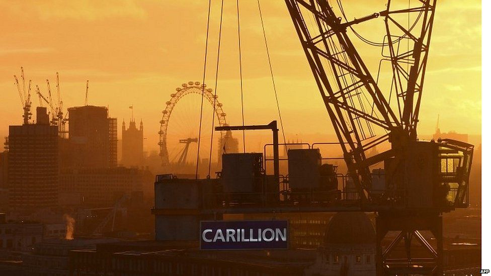 Construction crane in central London with Carillion banner on it