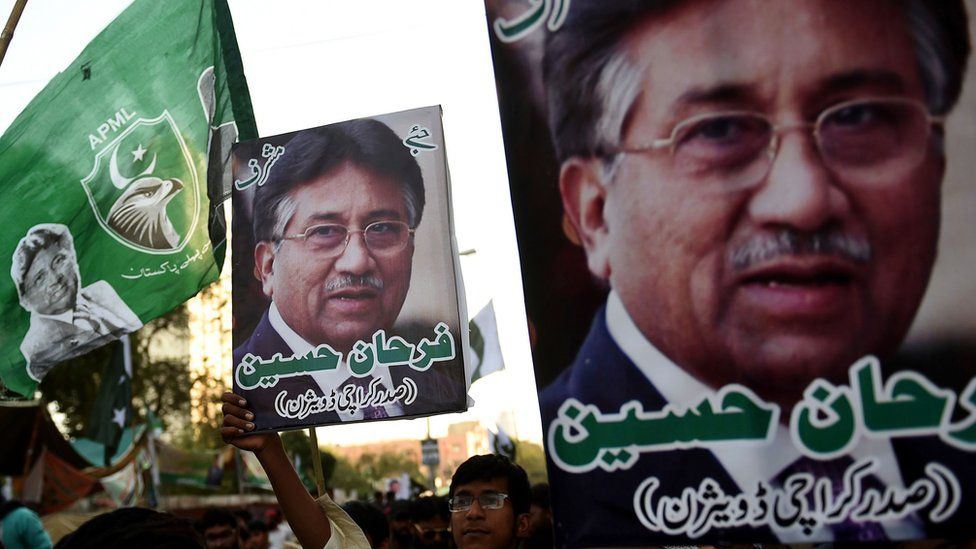 Demonstrators carry pictures of former military ruler Pervez Musharraf, during a protest following a special court"s verdict, in Karachi on December 24, 2019.
