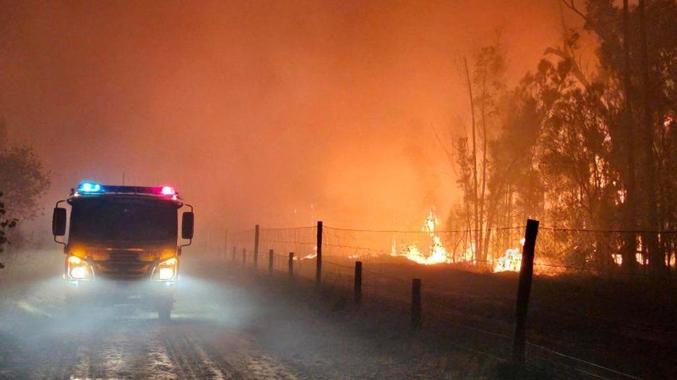 A firetruck near a bushfire