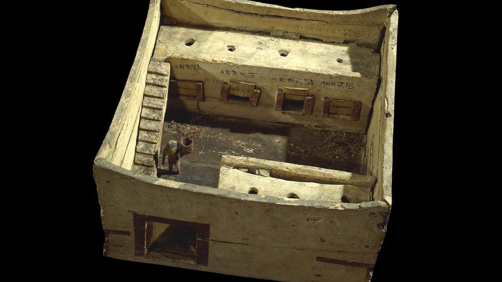 A painted wooden model of a granary from Egypt in around 2200 BC