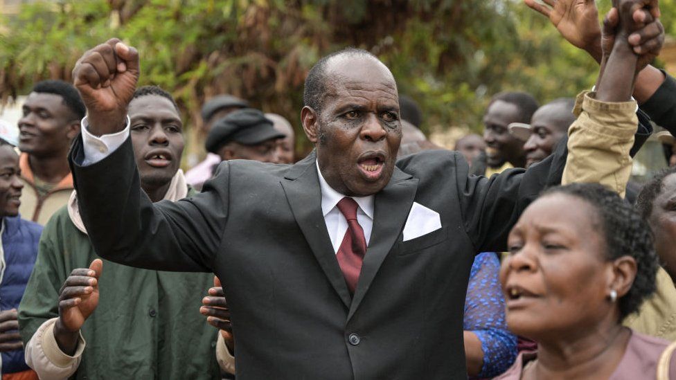 Gilbert Deya (C), celebrates outside the court with his followers after he was acquitted by the Milimani high courts in Nairobi on July 17, 2023