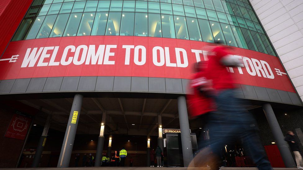 Old Trafford sign on stadium