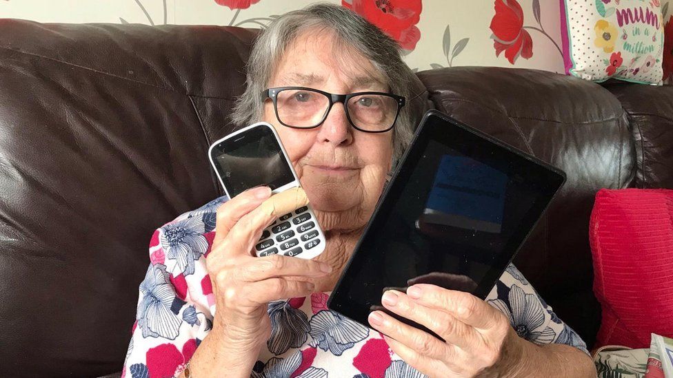 Brenda from Bristol with her phone and tablet