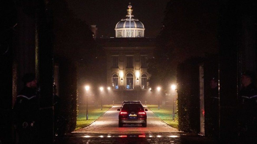 A vehicle carrying the royal family arrives back at Huis ten Bosch palace in The Hague