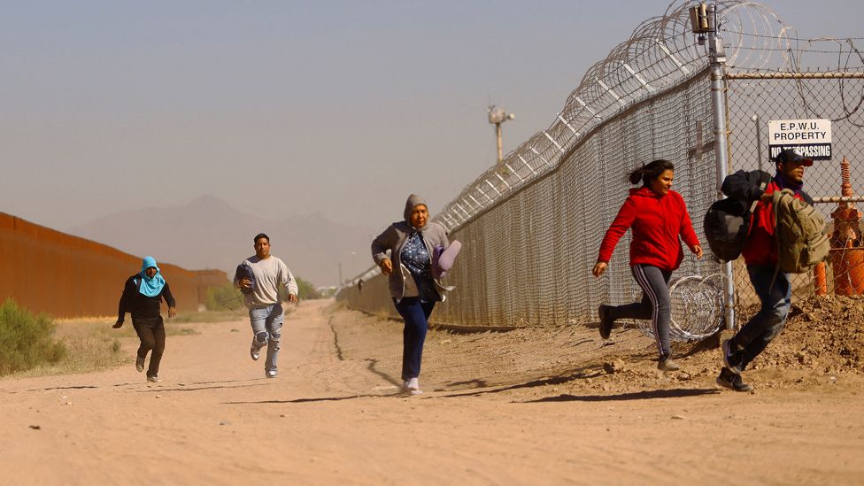 Migrants flee Border Patrol after crossing into US