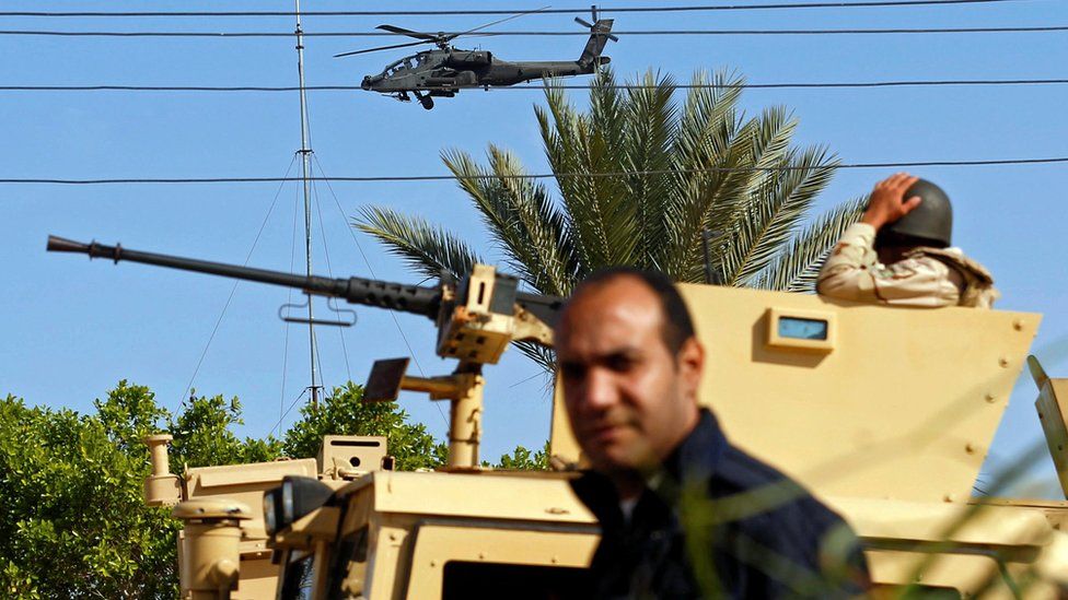 Military forces and helicopters secure an area in North Sinai, Egypt, 1 December 2017.