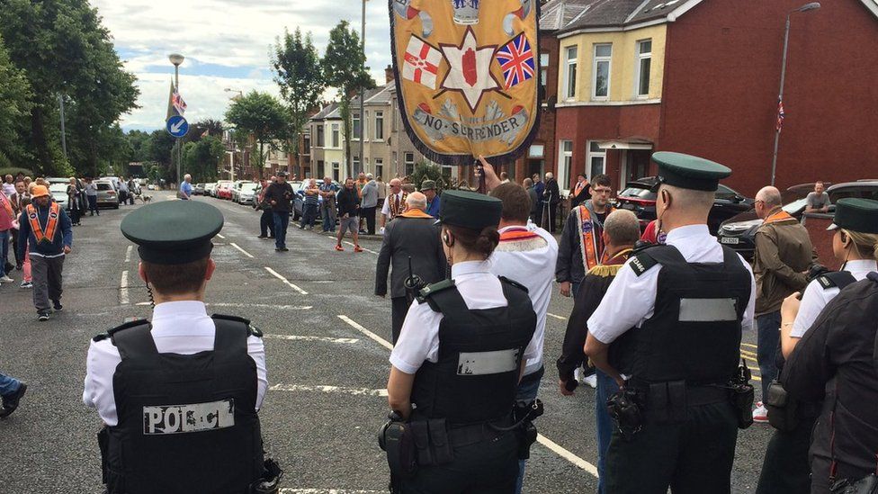 Members of the three lodges involved in the Ardoyne parade dispute arrived at police lines led by the Ballysillan banner on Saturday