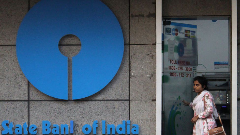 A woman walks out of an ATM of State Bank of India (SBI) in Mumbai, India on 07 February 2020.