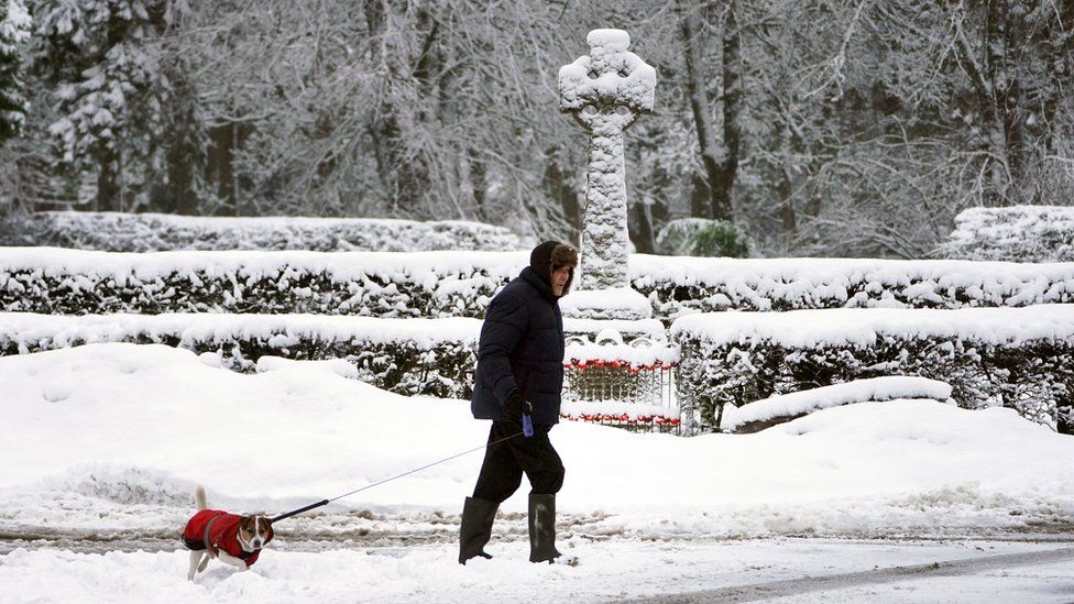 Man walking his dog in Allenheads, Northumbria