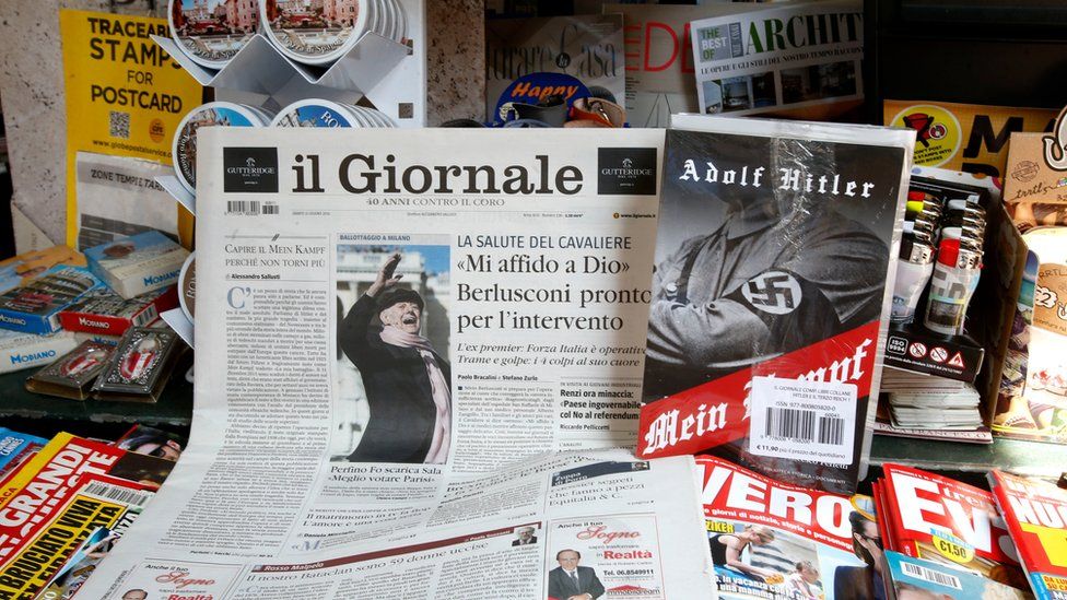 Il Giornale newspaper is seen on sale in a newsstand with Hitler's "Mein Kampf", in Rome Saturday, June 11, 2016.