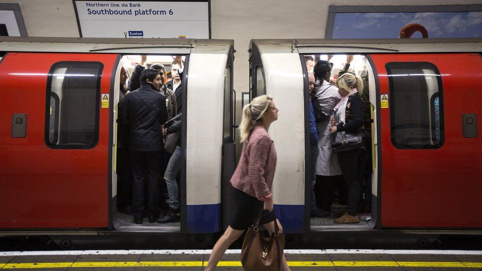 Passengers on a Tube train