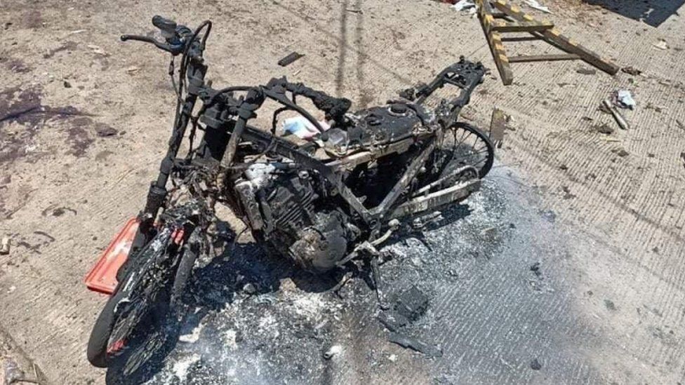Burned motorcycle is pictured in the aftermath of an explosion in Jolo Island, Sulu province, Philippines