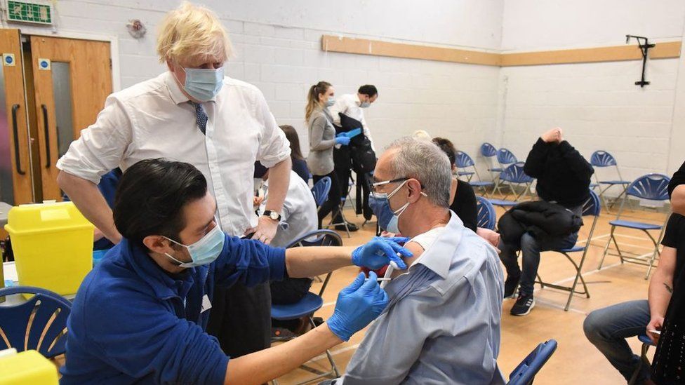 Boris Johnson visiting a vaccination centre in London