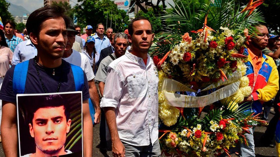 People participate in a march paying homage to student Juan Pablo Pernalete -killed on the eve by impact of a gas grenade during a protest against President Nicolas Maduro- in Caracas, on April 27, 2017