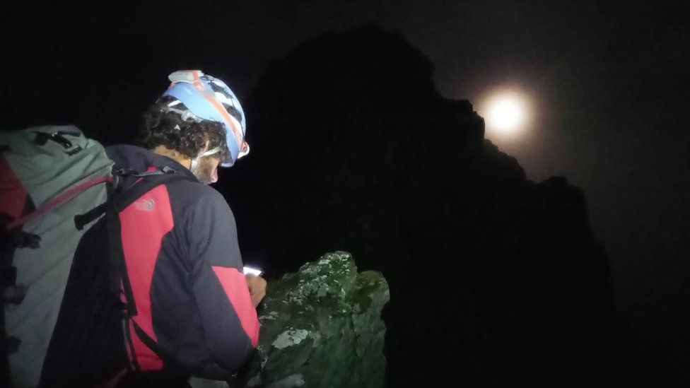 Rescuers searching the ridge in the dark