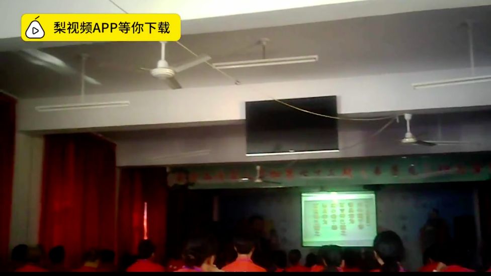 Screenshot of a Pear Video showing students in class