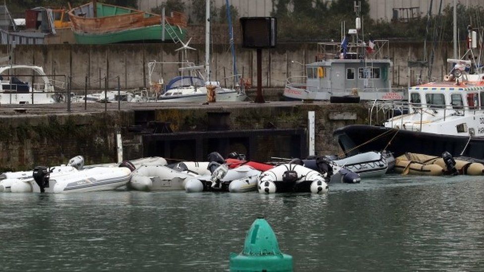 Small boats in storage after being used to bring migrants across to Dover