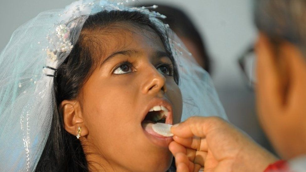Indian girl receiving communion (July 2012)