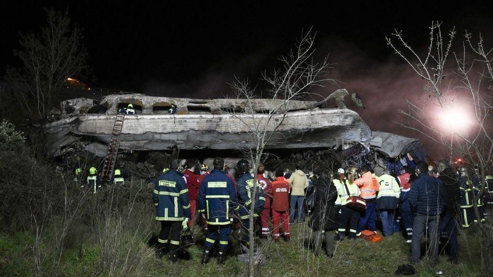 Rescue workers and emergency personel search the wreckage after a train accident in the Valley of Tempi near Larisa, Greece on 1 March 2023.