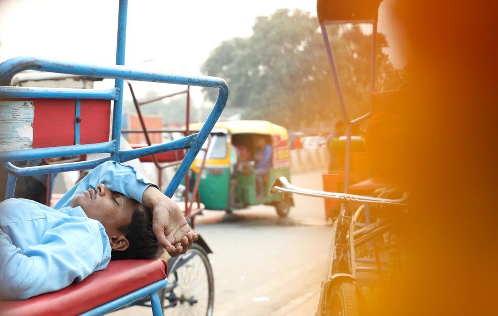 A rickshaw puller sleeping