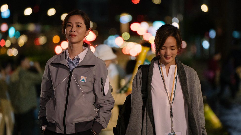 Hsieh Ying-xuan (left) and Gingle Wang walk next to each other in a scene from the show Wave Makers