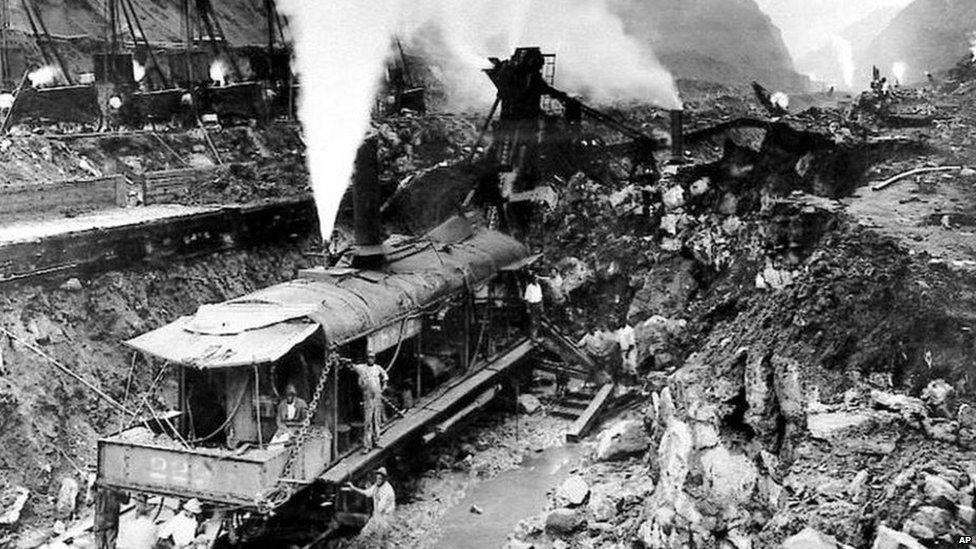 Steam shovels clear the last pile of rock, completing one of several deep cuts along the route of the Panama Canal, May 20, 1913.