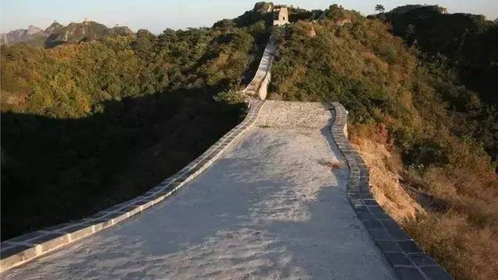 A long, cement-like path tops the stretch of the Great Wall after repairs