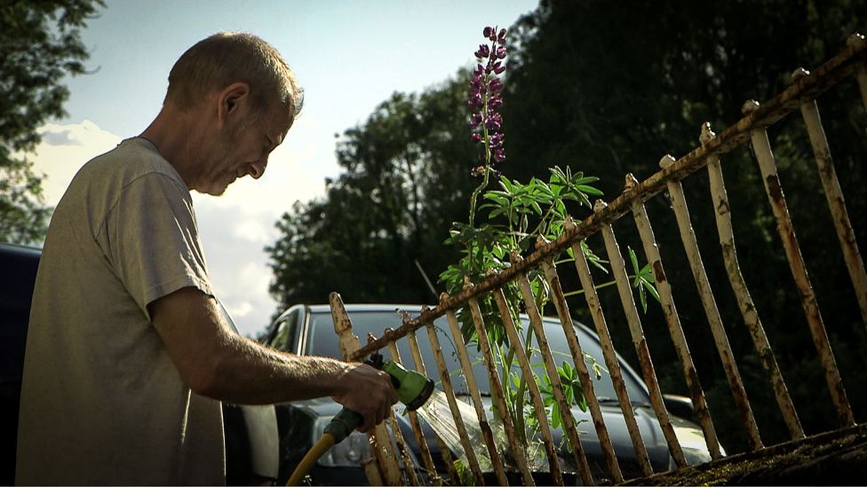 Ystalyfera resident Chris Jones watering his garden