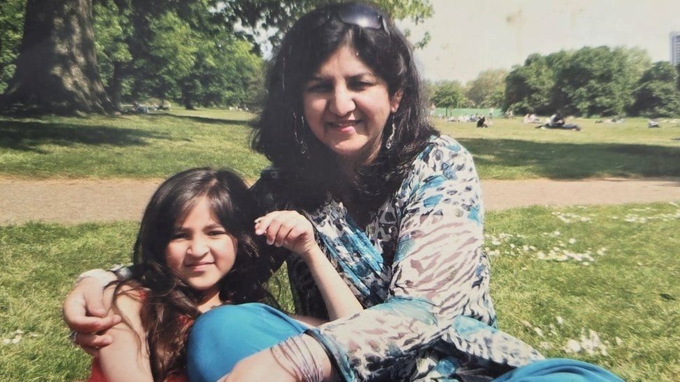 Nafisa Khan, smiling in a park with her daughter, in a picture taken 14 years ago