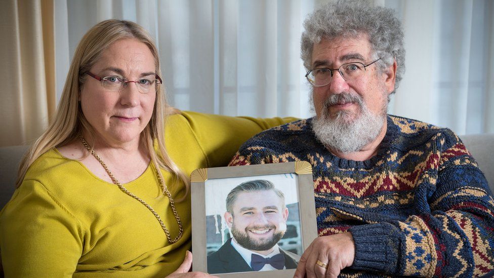 Mary Rich and her husband, Joel Rich hold a photo of their son, Seth Rich, who was murdered in Washington