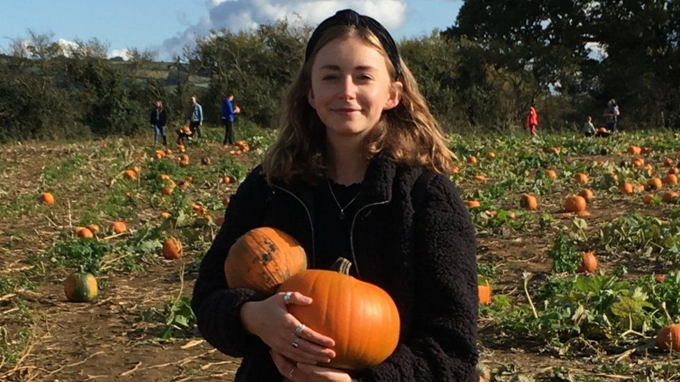 Eliza Hunt with her pumpkins