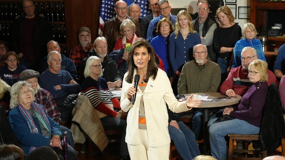 Photo of Nikki Haley speaking, surrounded by a seated audience