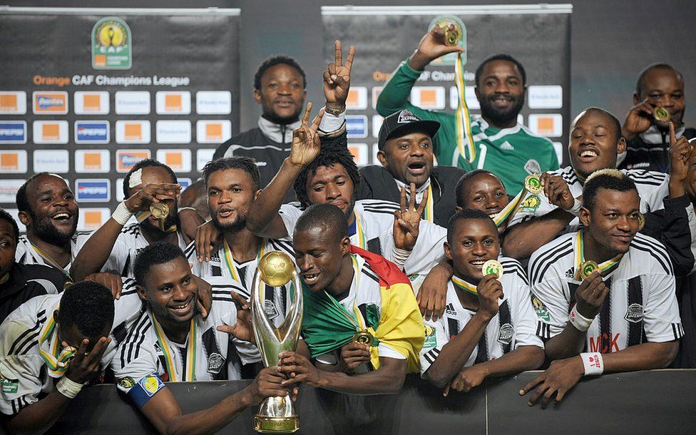 TP Mazembe celebrate winning the CAF Champions League trophy after beating Tunisia's Esperance de Tunis in the final in Tunis, in November 2010.