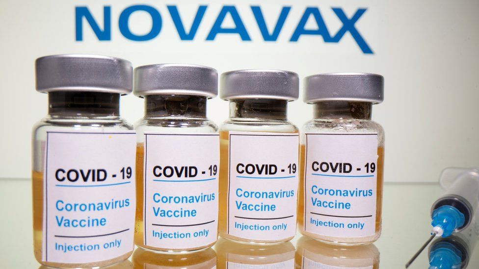Novavax logo behind vials