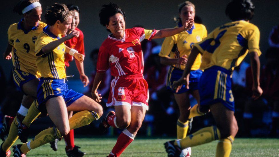 Sun Wen #9, forward for China attempts to dribble the football through the Swedish defence during the Group D match of the FIFA Women's World Cup against Sweden on 19th June 1999 at the Spartan Stadium in San Jose, California, United States. China won the game 2 - 1.
