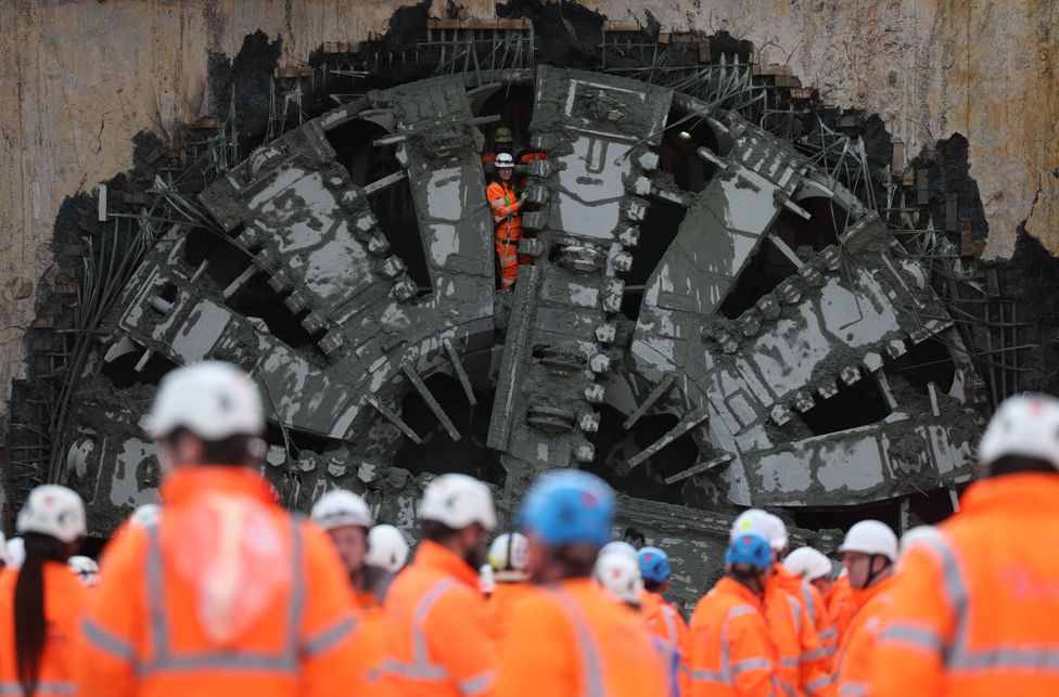 Workers watch after the cutting face of 'Florence' the boring machine breaks through on the Chiltern Tunnel in Great Missenden, Britain, 27 February 2024.