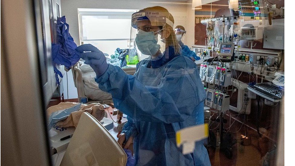 Medical workers treating a hospitalised Covid-19 patient in Connecticut on 22 January.