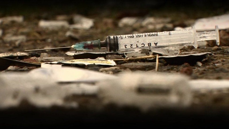 Syringe on floor