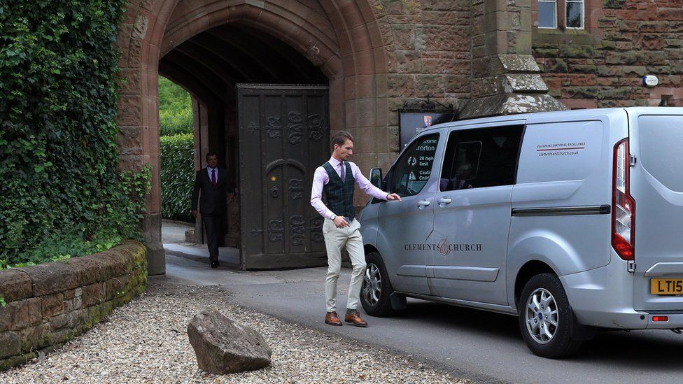 A van arrives at the castle