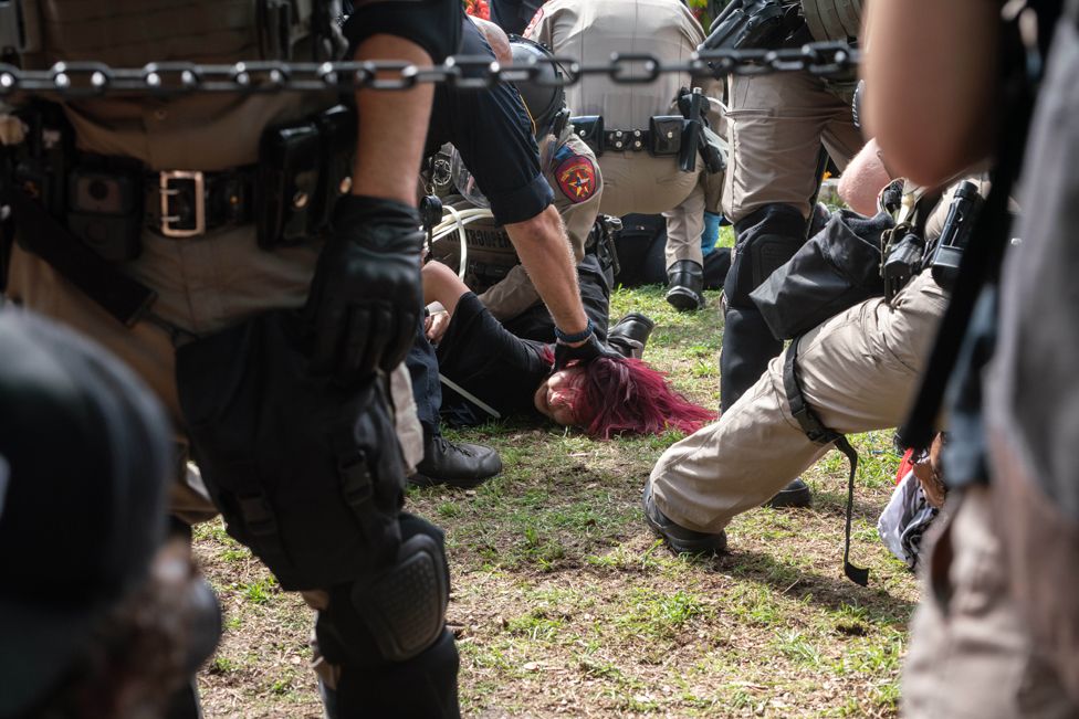 State Troopers arrest students and some faculty during a pro-Palestinian protest on the campus of the University of Texas in Austin, Texas, 24 April 2024