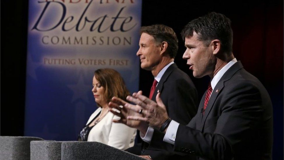 Libertarian Lucy Brenton (L), Democrat Evan Bayh (C) and Republican Todd Young (R) appear during a debate in Indianapolis.