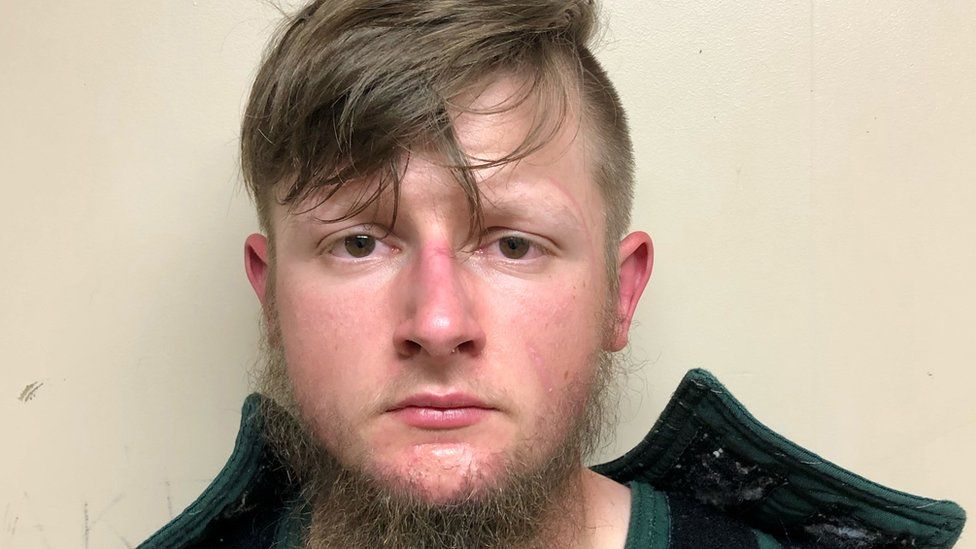 Robert Aaron Long, 21, of Woodstock in Cherokee County poses in a jail booking photograph after he was taken into custody by the Crisp County Sheriff"s Office in Cordele, Georgia, U.S. March 16, 2021.