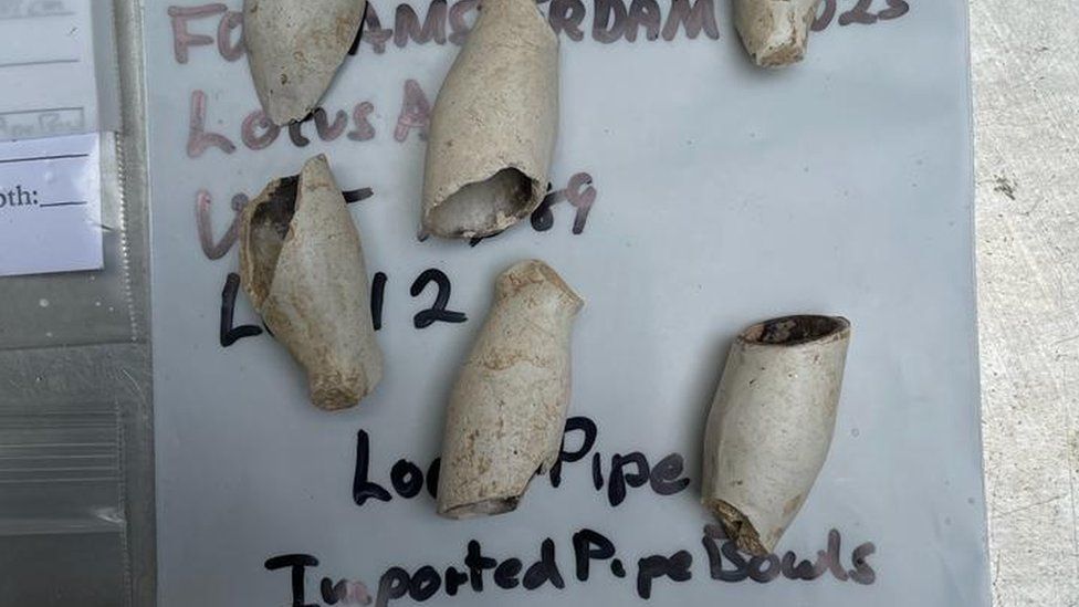 Clay pipe bowls found at dig site.
