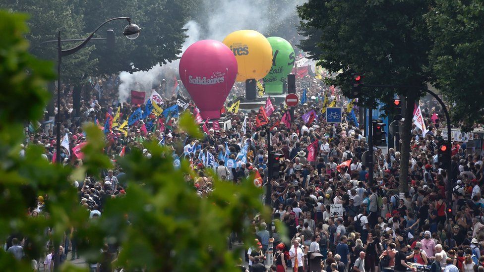People take part in a protest against the French government' proposed labour law reforms near the Place de la Bastille in Paris on 23 June