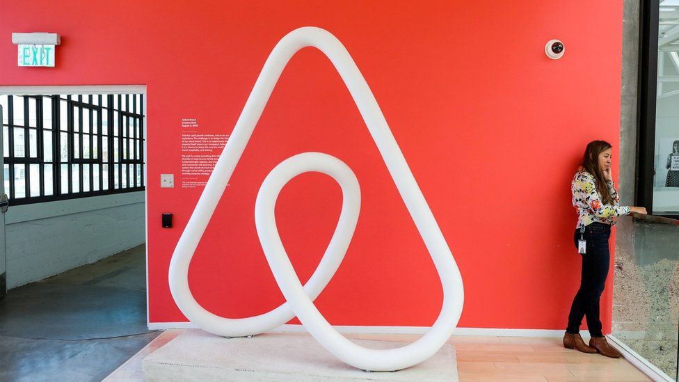 woman by Airbnb logo